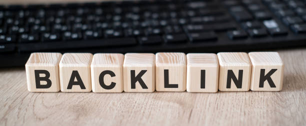 istock Back link - concept text on wooden cubes and in the background black keyboard 1224679500