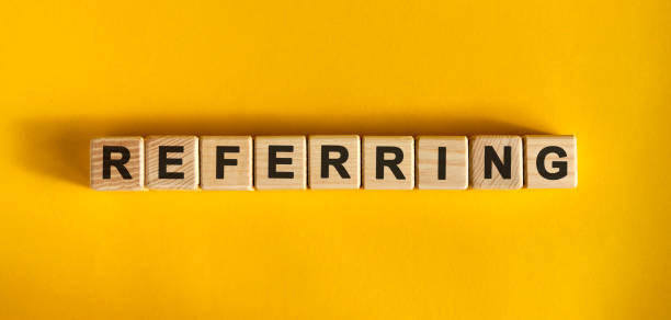 istock Referring - large wooden cubes with text on a yellow background 1224679507