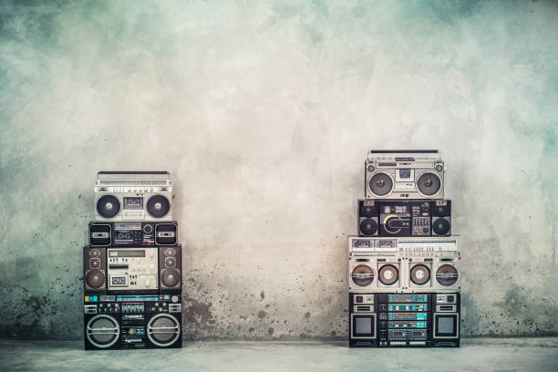 Retro old design ghetto blaster boombox radio cassette tape recorders from 1980s front concrete street wall. Nostalgic Rap, Hip Hop, R&B music concept. Vintage style filtered photo Retro old design ghetto blaster boombox radio cassette tape recorders from 1980s front concrete street wall. Nostalgic Rap, Hip Hop, R&B music concept. Vintage style filtered photo reggae stock pictures, royalty-free photos & images