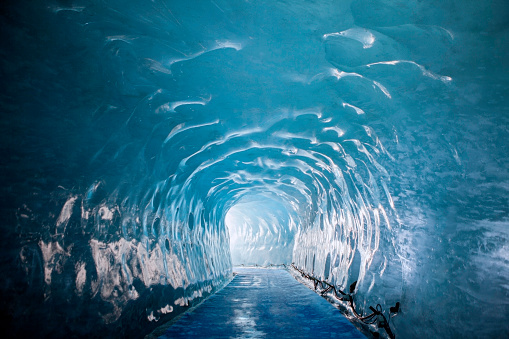 tunnel carved through glacier near mont blanc