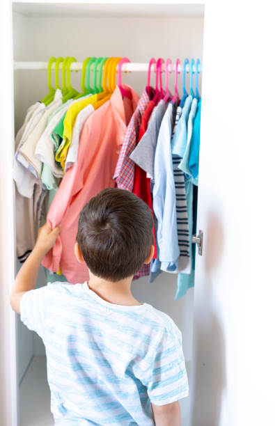istock Small boy in front of wardrobe 1224685004