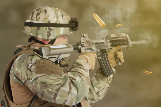 istock US ARMY soldier shooting from assault rifle 1224688431