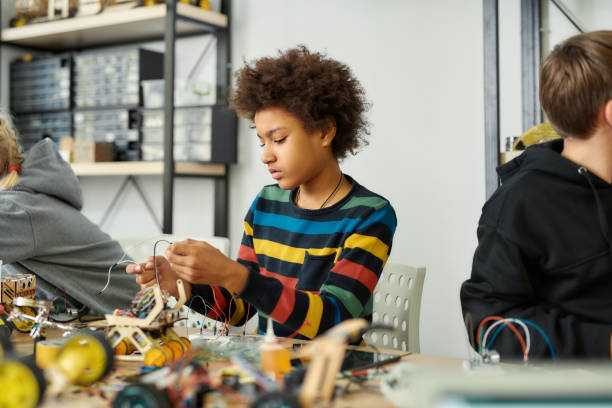 istock Exploring new possibilities. African american kid at a stem robotics class making his own vehicle. Smart children and STEM education. 1224692787