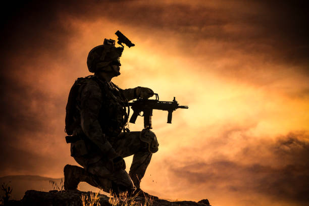 istock Silhouette of  soldier on abstract orange  background 1224693053