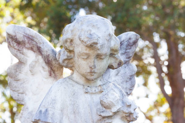 istock Angel, old statue of little angle,  background with copy space 1224701636