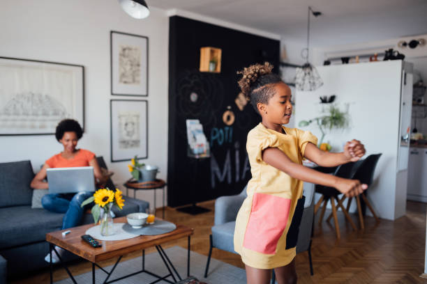 istock Little girl learning to dance at home 1224701892