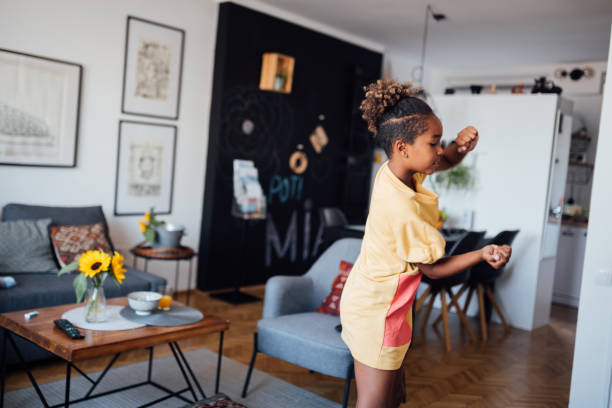 istock Little girl dancing at home 1224701893