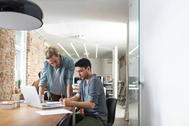 istock Two Businessmen Cooperating at the Office, Modern Business Concept 1224701965