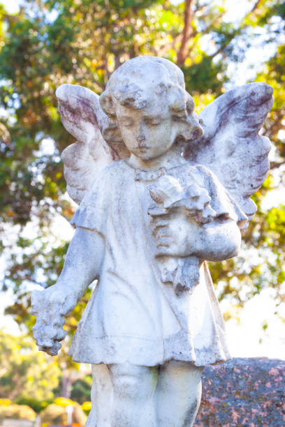 istock Angel, old statue of little angle,  background with copy space 1224702198