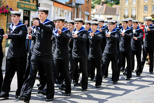 UK Armed Forces Day Parade Royal Navy Sailors from HMS Heron Marching through Sherborne Dorset