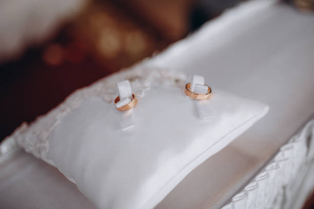 istock Golden wedding rings lie on the ropes in a box. 1224704978