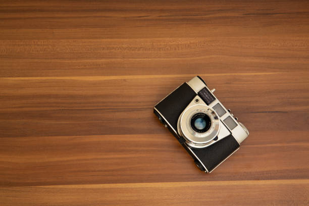 istock Vintage film camera on wood background 1224705215