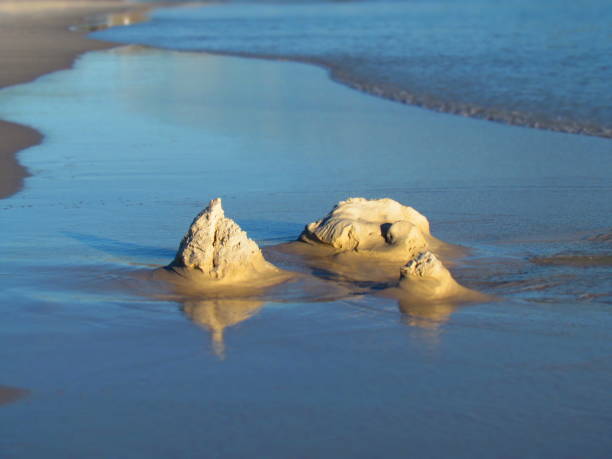 istock High tide brings down the sandcastle 1224705314