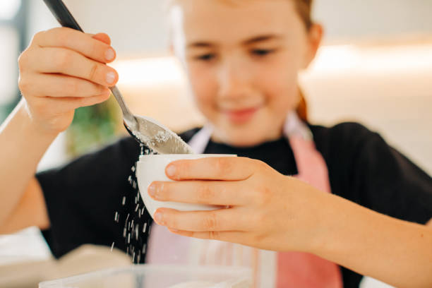 istock Young girl baking in a modern kitchen. 1224706363