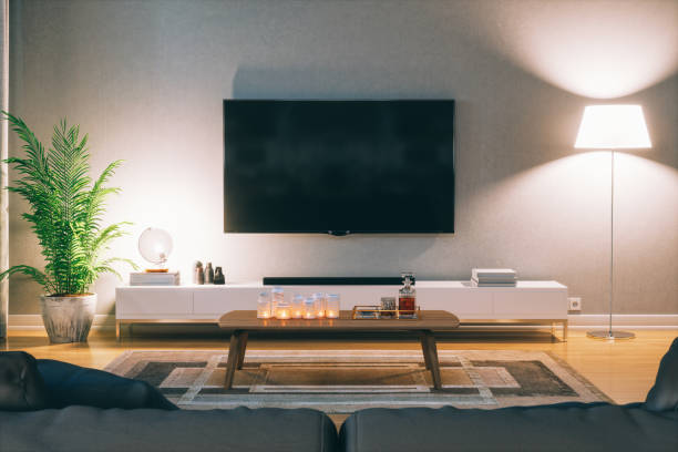 Scandinavian Style Modern Living Room With Television At Night Cozy scandinavian stlye living room with home entertainment center at night. television set stock pictures, royalty-free photos & images