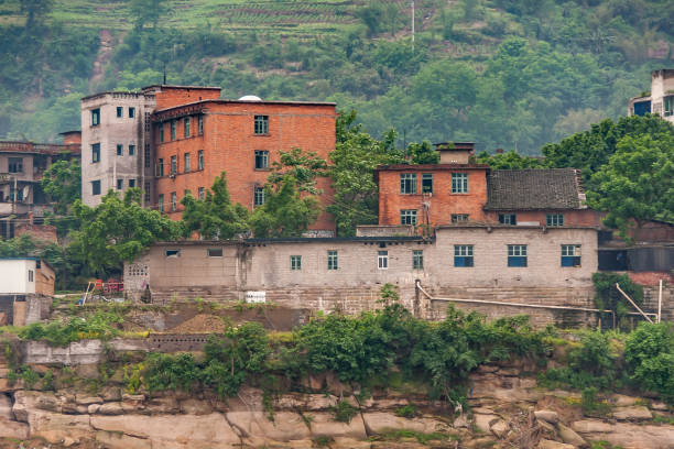 istock Red brick building on shoreline along Yangtze River, China. 1224712030