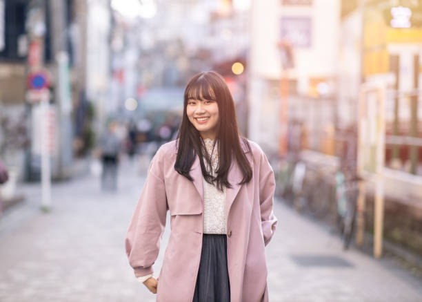 Portrait of young woman standing on street Portrait of young woman standing on street tokyo harajuku stock pictures, royalty-free photos & images