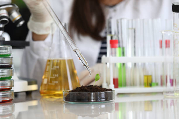 istock Woman conducts chemical analysis fluid samples 1224713573