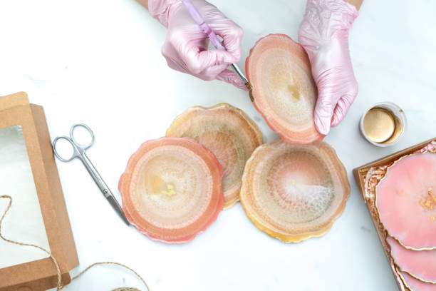 istock Creativity and craft. A young girl creates coasters from resin. Gift wrapping. Decorative packaging. Idea for business. Remote work, work at home. Art coasters. 1224713584