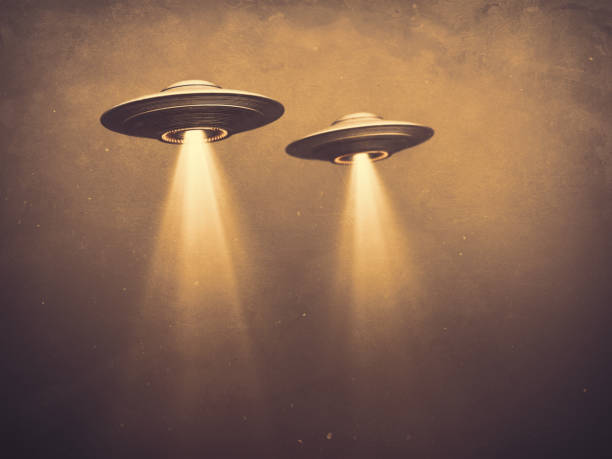 Unidentified Flying Object UFO Old Time Photography Two UFOs flying in fog with light below. 3D illustration monochromatic sepia-toned old-time photography. Concept image with blank space below the UFOs for texts and image. ufo stock pictures, royalty-free photos & images