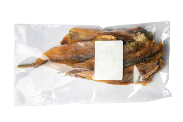 istock Dried perch in a transparent package white label appetizer to beer isolated on white background. Snack Fish to beer. Close up 1224715610