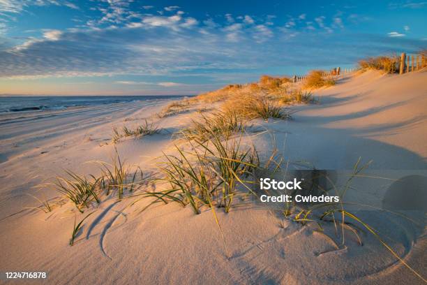 Azure Blue Sky And Puffy Clouds Just After Sunrise On The Beach At Beach Haven Stock Photo - Download Image Now