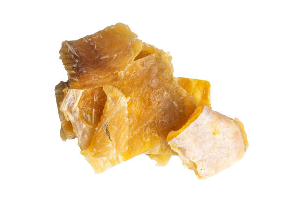 istock Dried cod fillet isolated on a white bacground. Snack on fish with beer. Close-up 1224720345