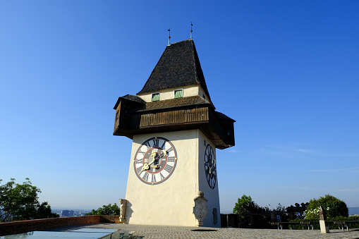 Historical Clock tower Uhrturm and old town in Graz, Austria