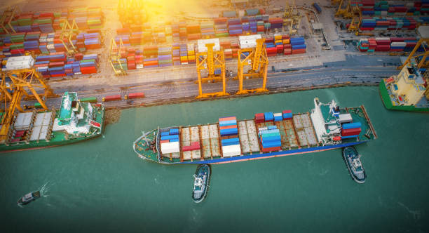 istock Logistics and transportation of Container Cargo ship and Cargo plane with working crane bridge in shipyard at sunrise, logistic import export and transport industry background 1224725257