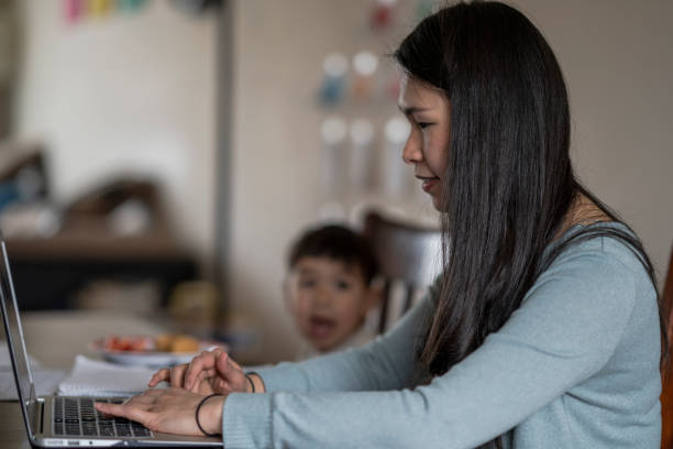 istock Mother Working from Home with Toddler Son 1224726314