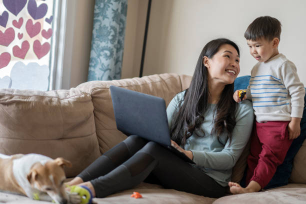istock Mother and Son Using Computer Together to Connect with Family and Friends 1224726355