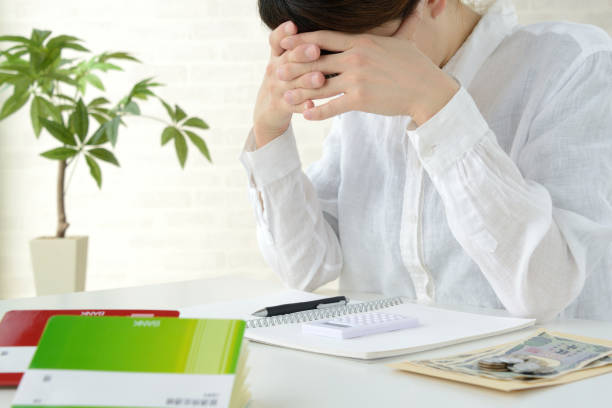 Japanese woman depressed by severe living cost Japanese woman depressed by severe living cost lorne stock pictures, royalty-free photos & images