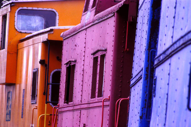 istock Three Red, Yellow and Blue Railroad Cars 1224727392