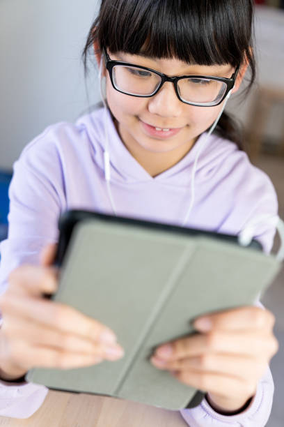 istock Female teenager using digital tablet for live chat 1224728041