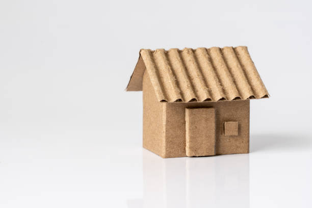 Model of cardboard house isolated white background Model of cardboard house isolated on white background for building, mortgage, real estate or buying a new home concept. cardboard house stock pictures, royalty-free photos & images