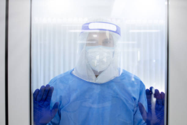 istock Nurse is looking out in the quarantine room 1224729328