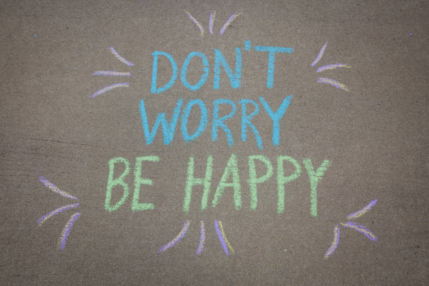 Don't Worry Be Happy written with sidewalk chalk