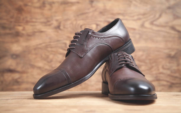 istock Brown shoes on the wooden background. 1224734592