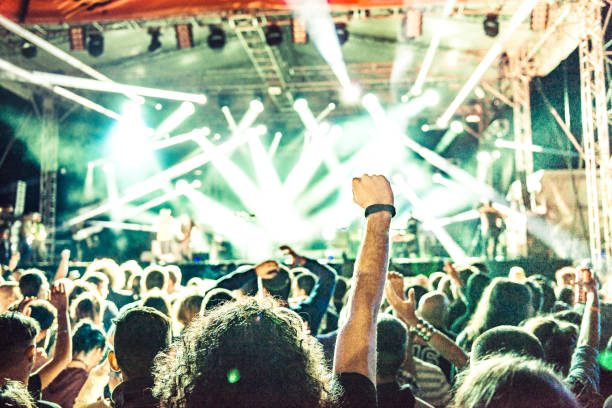 istock cheering crowd at rock concert 1224735830