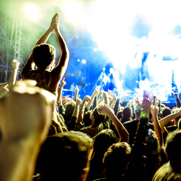 istock cheering crowd at rock concert 1224736625