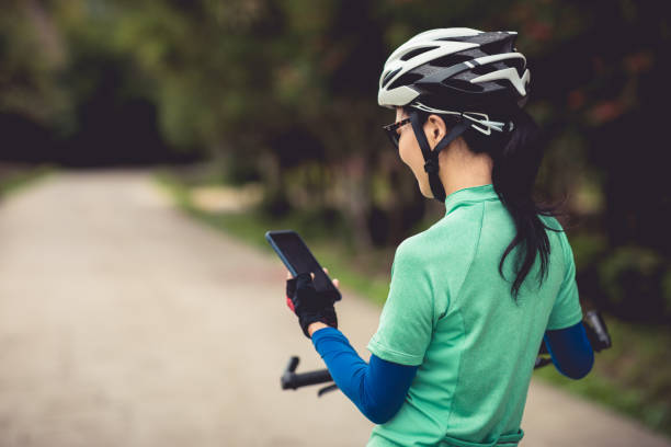 istock Cyclist use smartphone for navigation when riding mountain bike on forest trail 1224738595