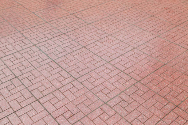 Perspective view brick stone pavement on the ground for Street Road. Vintage ground flooring square pattern texture for mock up.