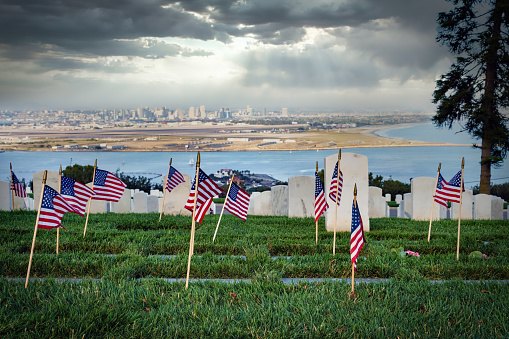 American Flags on graves on Memorial Day at a national cemetery in southern California.