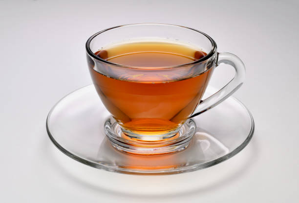 istock Tea in transparent glass cup on white background 1224747506