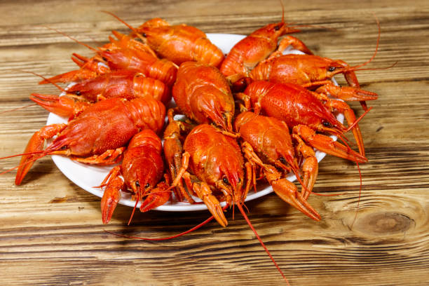 istock Boiled crayfish in plate on wooden table 1224748416