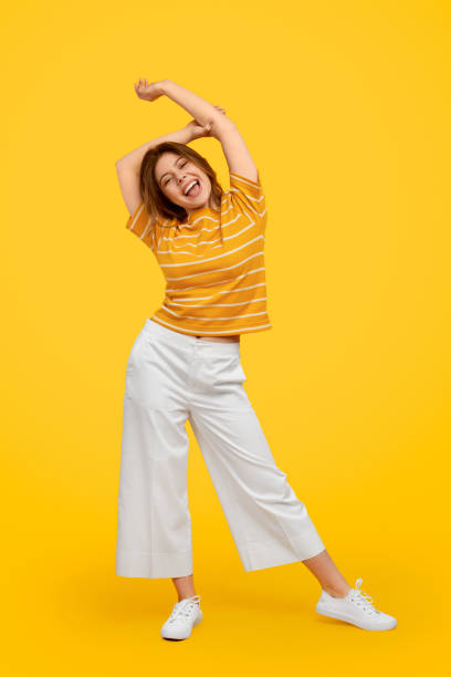 istock Happy young female with raised hands 1224749616