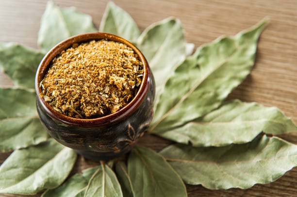 istock spice with bay leaf on wooden background 1224749839