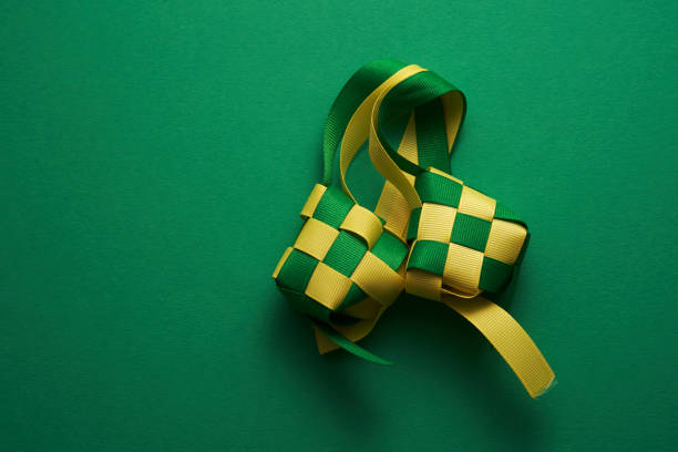 ribbon ketupat on green background