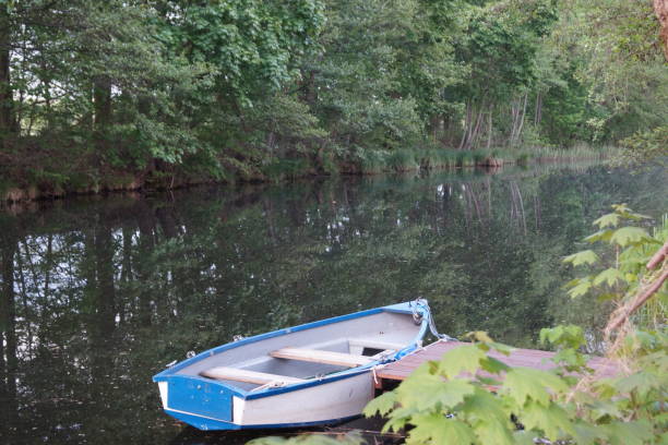 istock Lonely blue-and-white boat on the canal 1224752913