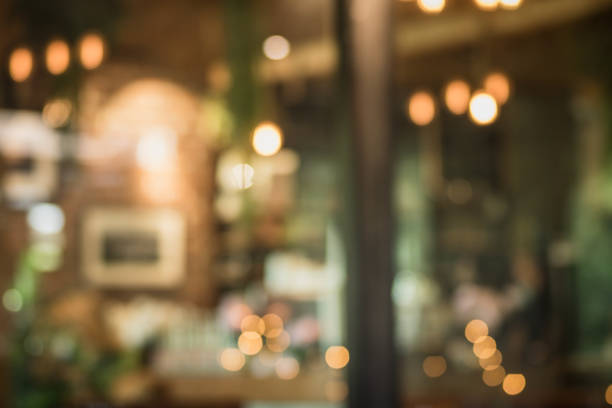 istock abstract blur of interior inside coffee cafe shop background with light effect for design element. Blurred cafe background with bokeh. orange ,red, light. 1224754325